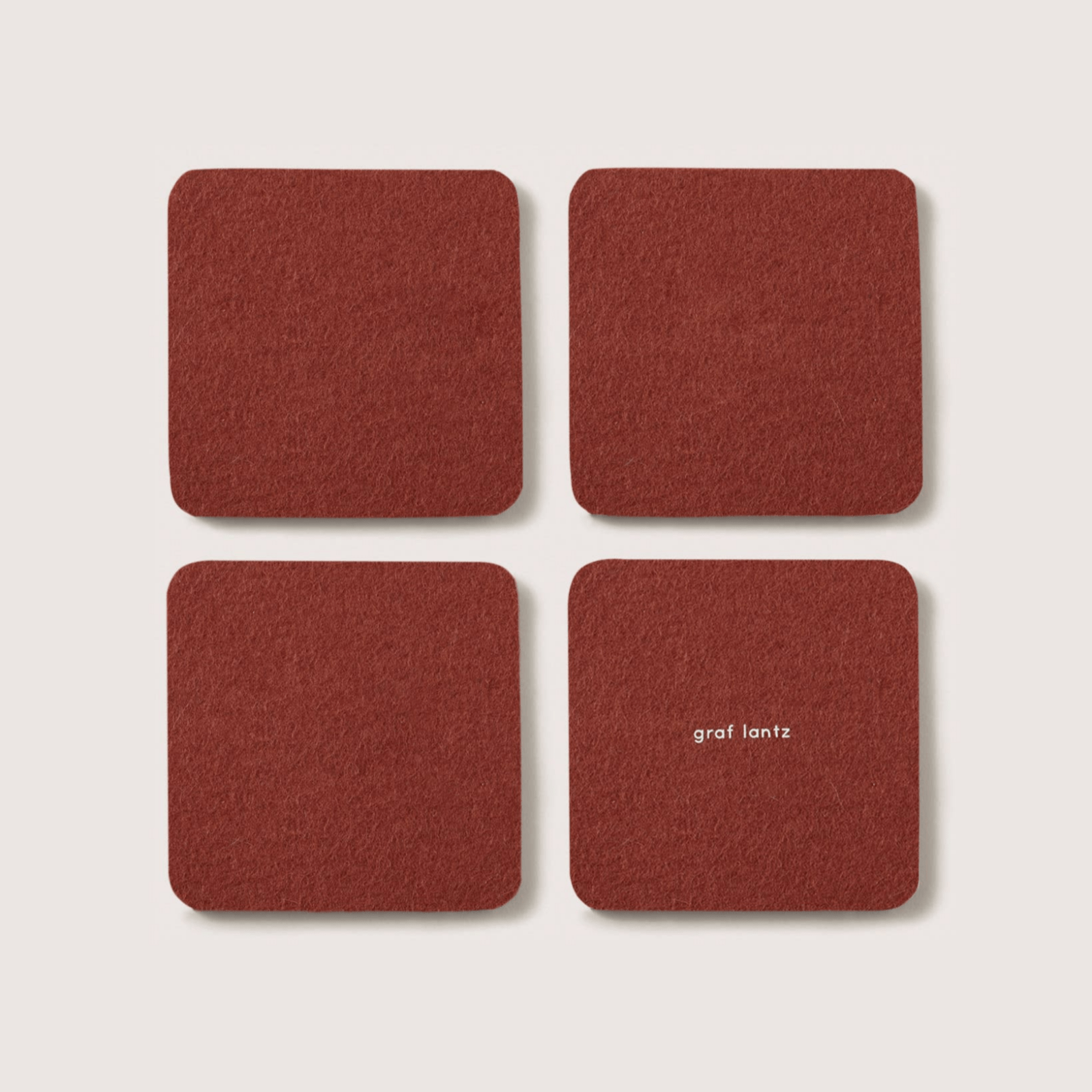 Graf Lantz · Bierfilzl Merino Wool Square Coaster Solid 4 Pack · Terracotta | socius design in Rochester, MN